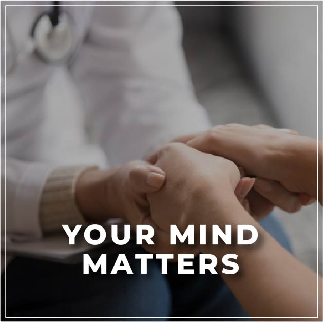 a psychologist holding hands with the patient